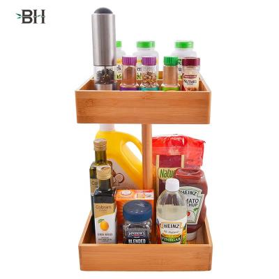 China Sustainable bamboo kitchen and snack organizer. 360 rotating, 2 tier high capacity wooden storage rack for sale