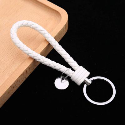 China Modern Handwoven Leather Weaving Key Ring Key Chain Lanyards Keychains for Women and Men for sale