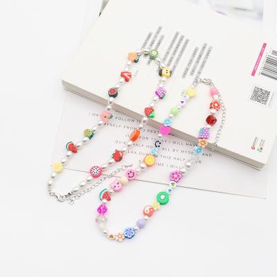 China Fashionable Cell Phone Border Straps Bead Gold New Design Debut Fruit Beaded Phone Case With Wrist Strap for sale