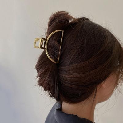 China Women Girls Hair Accessories European Fashion Trendy Half Round Jumbo Gold Alloy Hollow Hair Claw Clips For Women Girls for sale