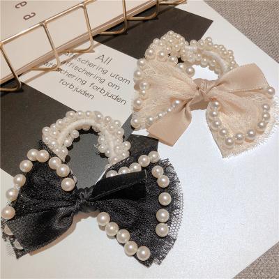 China Fashionable Elegant Bowknot Ponytail Swatch Pearl Hair Bow Elastic Women Girls Women Hair Tie for sale