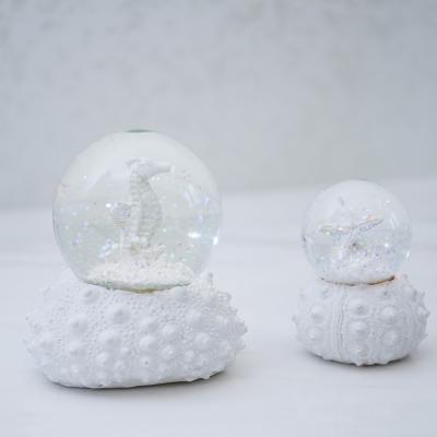 China Europe Beach Gift Large Family Resin Waterball Craft Musical Water Themed Holy Musical Ball Smoky Mountains Snow Globe for sale