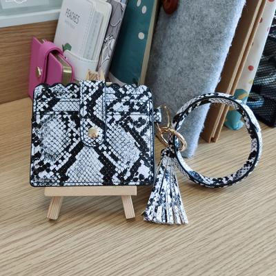 China Customized Cute Personal Luxury Leather Wristband Purse Card Holder Security Waterproof Key Chain Wallet for sale