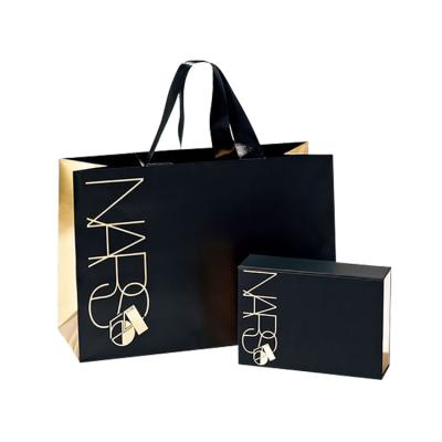 China Customized Recyclable Matte Black Luxury Logo Paper Bag Boutique Gift Packing Ribbon Handle Shopping Bag For Clothing Store for sale