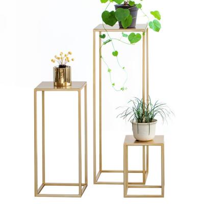 China Modern simple floor type standing flower stand balcony living room balcony iron gold pot hanging rack set of 3 pieces for sale