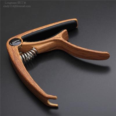 China Acoustic Guitar Ukulele GUITAR lead capo change zinc alloy and electric and bottom wood grain color capo for sale