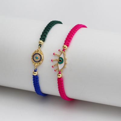 China Fashion Evil Eye Rope Cotton String Adjustable Pink Zircon Eye Bracelet European Handmade Lead Free Nickel Free Charm Bracelet for sale