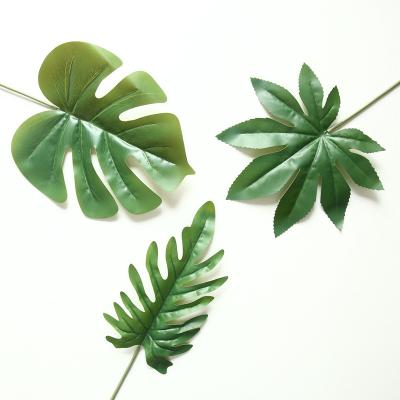 China Beautiful Colorful Hot selling Artificial Greenery Plants Plastic Leaves monstera deliciosa For Home Festival Party Wedding Decoration for sale