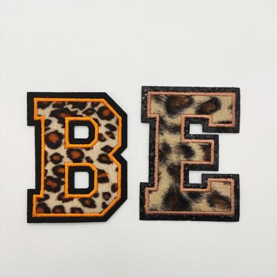 China Fashion Hat Apparel Handbag Leopard Print Letter Embroidery Patches Viable Logo Customized Woven Letter Patch for sale