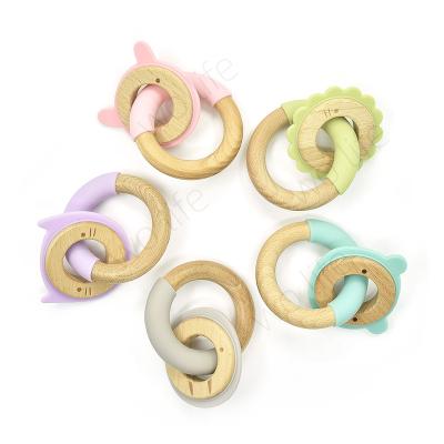 China Eco-Friendly Silicone Funny Toys Little Rawr Ring Toy Cute Cartoon Animal Wooden Clip Ring Silicone Wooden Baby Teether Toy Set For Toddler for sale