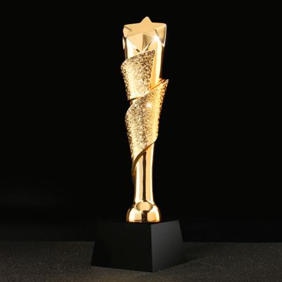 China Gold Rising Star Crystal Trophy Resin Award for sale