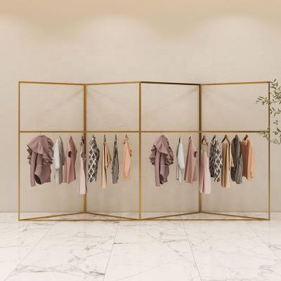 China Durable Gold Clothing Store Counter Design Metal Clothes Display Racks For Garment Shop for sale