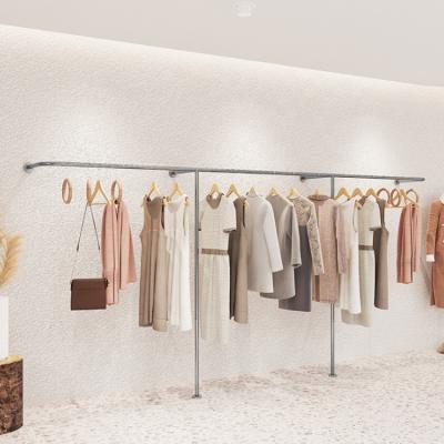 China Store Display Rack Clothing Store Display System Gold Stainless Steel Floor Rack Shop Clothes Show Wall Rack Shelves for sale