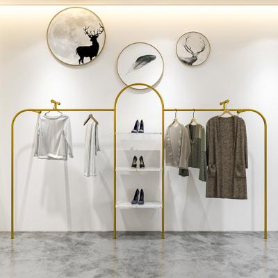 China Gold bridal wall mounted metal shop hanging rack for clothing store showroom display stand furniture for sale