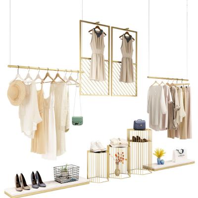 China Displaying Goods Customized Wall Mounted Clothing Display Metal Gold Shoe Billboard Hanging System Rack for sale