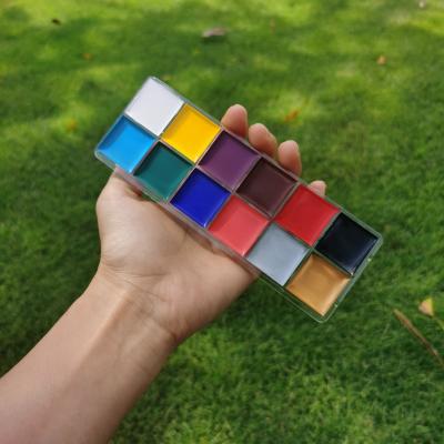 China 2021 Non-Toxic New Makeup Halloween Palette Kit 12 Colors African Body Paint Brush Sticks Stenciling Rainbow Face Paint Private Label for sale