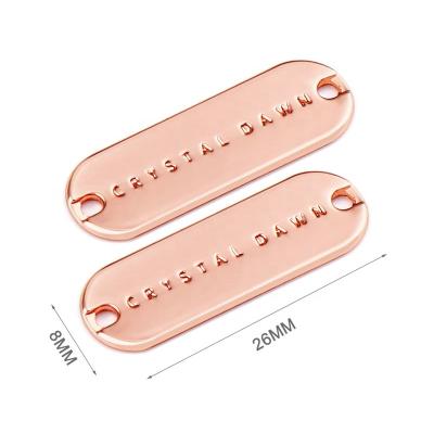 China Sustainable Swimwear Bikini Rose Gold Sewing Metal Name Tag Label , Custom Apparel Logo Metal Labels For Garment for sale