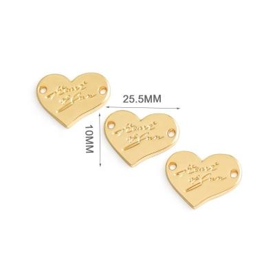 China Custom Viable Heart Shape With Logo Sewing Metal Clothes Label Engraved, Gold Metal Tags With Holes For Clothing for sale