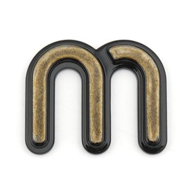 China Eco-friendly antique design metal letter custom brand brass adhesive unique logo erasing metal logo for bags for sale