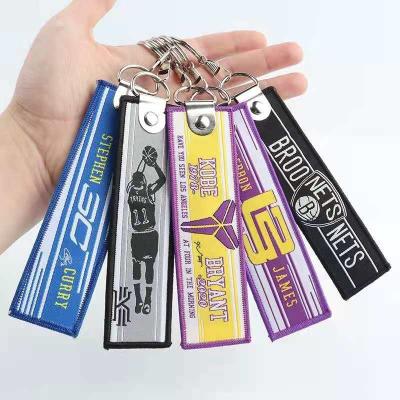 China Safe Wholesale Fashion Basketball Key Chain Accessories Tag Brand Custom Embroidery NBA Logo Key Chain for sale