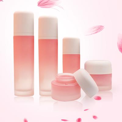 China 100ml 120ml 50g Custom Luxury Empty Gradient Eco-friendly Pink Round Cosmetic Packaging Glass Bottle Toner Lotion Pump And Cream Jar Set for sale