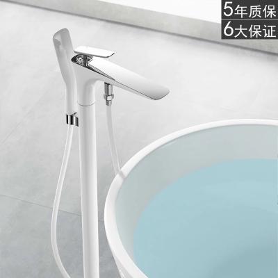 China Freestanding White Floor Mount Tub Filler Single Handle Brass Slide Bar Tub Faucet With Hand Shower for sale