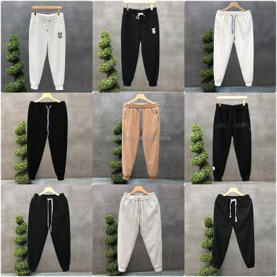 China Anti-wrinkle 2023 Latest men's sweatpants Gym sweatpants Bodybuilding Jogger sweatpants Men running cotton pencil pants men for sale