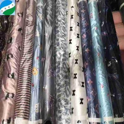 China 100% fabric spandex memory polyester satin nice print stock fabric blended in stock tela stampada for sale