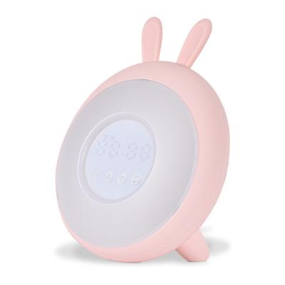 China Lovely Rabbit Silicone Bedside Radio Sunrise Wake Up Light LED Table Digital Alarm Clock For Kids for sale