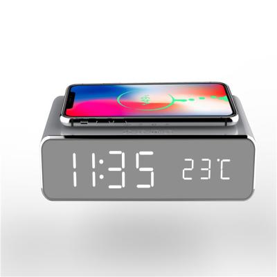 China 2022 Radio Amazon New Arrivals Temperature Display Smart Phone Alarm Clock Qi Charger Digital Wireless Charging Table Clock for sale