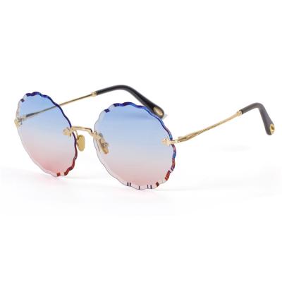 China Fashion Sunglasses Round Shaped Rimless Sunglasses Flower Sunglasses Metal Lenses Gradient UV400 Lenses for sale