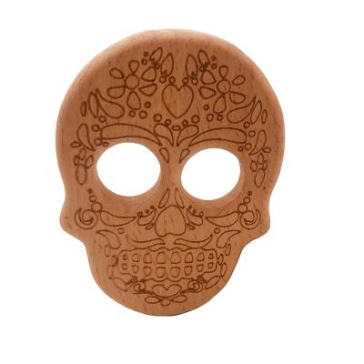 China Wooden Skull Teether Pain Baby Teething Beech Soothing Baby Pendant Wholesale Teether Toys Best Baby Gift for sale