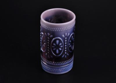 China Unique Candle Holder Colored Glass Candle Jars With Embossed Pattern for sale