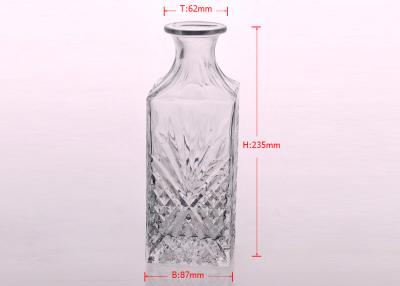 China Superior embossed clear Glass Wine Bottles with cork lid , Machine made for sale