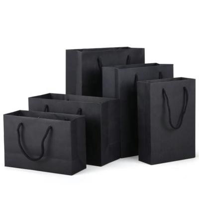 China Recycled Materials Custom Printed Logo Business Packaging Gift Wrap Bag Black Cardboard Shopping Paper Bags For Clothing for sale