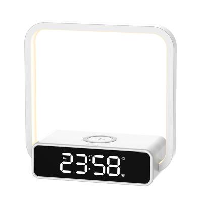 China 2021 Modern New Design 3 in 1 Hotel Bedroom Nightstand Alarm Clock LED Desk Lamp Portable Smart QI Wireless Charger for sale