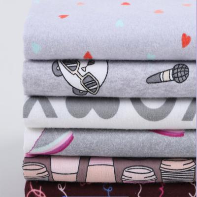 China Twill cotton flannel fabric wholesale reactive printing pajiama flannel shirt fabric Shrink-resistant twill baby blanket bedding for sale