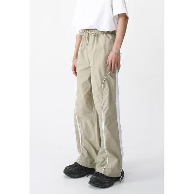 China 2023 QUICK DRY unisex panels sports contrast casual woven soft loose straight pants american street pants for sale