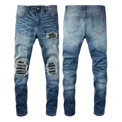 China Viable streetstyle new European and American fashion men's hole fashion casual blue jeans stretch slim fit pants for sale