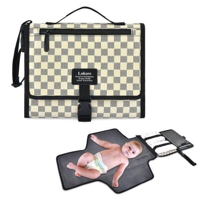 China Waterproof Portable Floral Baby Diaper Clutch Light Weight Baby Changing Pad Changing Mat with Stroller Strap for Mom for sale