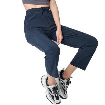 China Anti-wrinkle new products fashion drawstring solid color pocket unisex women's pants outdoor pants for sale