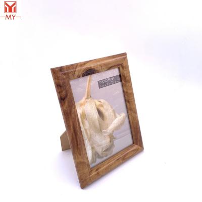 China PS Plastic Curved Line Photo Frame New Brown Style Wood Frame Environmental Friendly Hot Sale Design For Home Decoration for sale