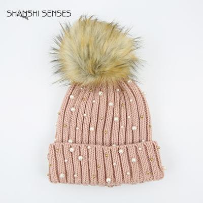 China Cute JOINT Ladies Pearl Faux Fur Pom Pom Beanies Bright Color for sale