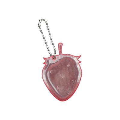 China Easy To Wear Cute Strawberry Pendant Reflector Light PVC EN13356 Reflective Key Chain for sale