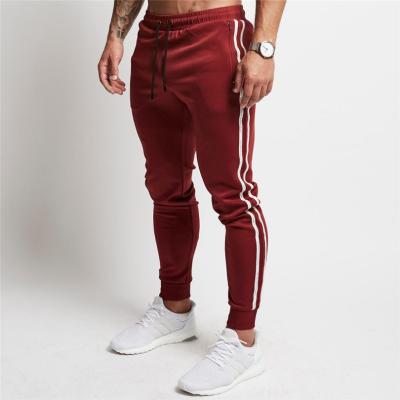 China 2021 Anti-wrinkle comfortable sportswear custom cotton side striped men fitness tapered jogger pants for sale