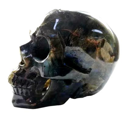 China Natural Donghai Feldspar Drawn Hollow Skulls Healing Quartz Skulls Feng Shui Crystal Decoration for sale