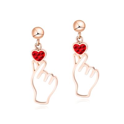 China FASHIONABLE Korean style personality hollow finger heart earrings rose gold drop earring for women custom backed for sale