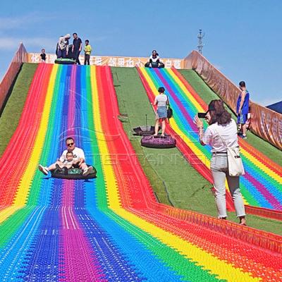 China Outdoor Scenic Slide Seven Colors Rainbow Plastic Slide Adult Children Scenic Area For Sale Te koop