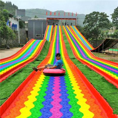 China Newest Outdoor Scenic Area Playground Amusement Park Equipment Rainbow Slide Kids And Adults Plastic Rainbow Slide Te koop