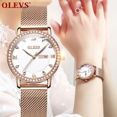 China Water Resistant OLEVS Lady Fashion Girls Small White Watches Latest Classic Simple Stylish Quartz Shiny Women Watches for sale